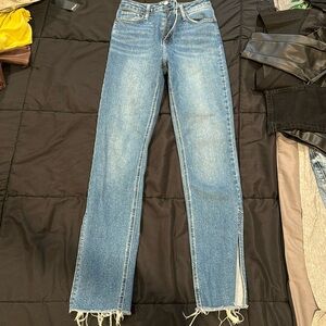 Blue jeans with ankle slit